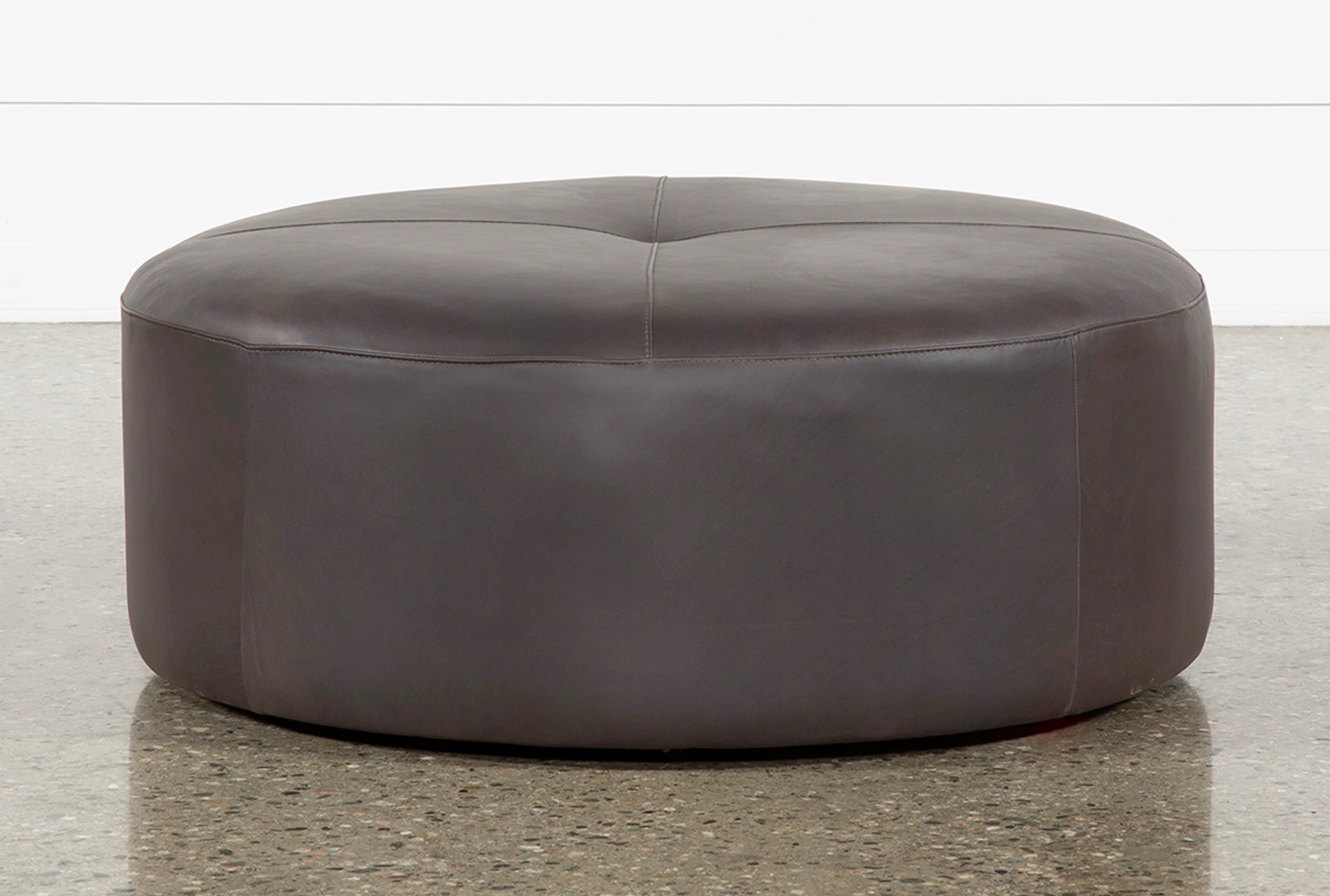 round leather ottoman with legs