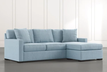 Taren II Light Blue Reversible Sofa/Chaise Sleeper W/Storage Ottoman