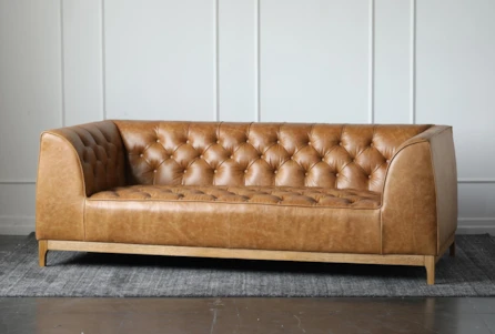 Tufted Leather Oak Sofa Living Spaces, What Does Tufted Leather Mean