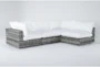 Retreat Outdoor 4 Piece Grey Woven Modular Chaise Sectional With White Cushions - Signature