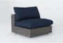 Retreat Outdoor Brown Woven Armless Unit With Navy Cushion - Side