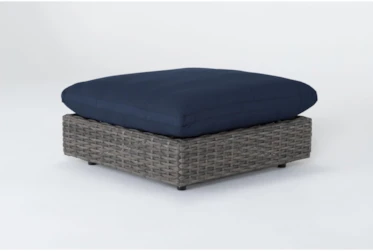 Retreat Outdoor Brown Woven Ottoman With Navy Cushions