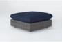 Retreat Outdoor Brown Woven Ottoman With Navy Cushions - Signature