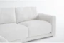 Dreanna 4 Piece Sectional with Left Arm Facing Chaise, Leather Swivel Chair & Leather Ottoman - Detail