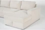 Sebastian Cream 111" 2 Piece Convertible Sleeper Sectional with Right Arm Facing Storage Chaise - Detail