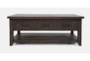 Madi Brown Storage Coffee Table With Wheels - Signature