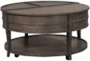 Quincy Lift-Top Round Coffee Table With Wheels - Signature